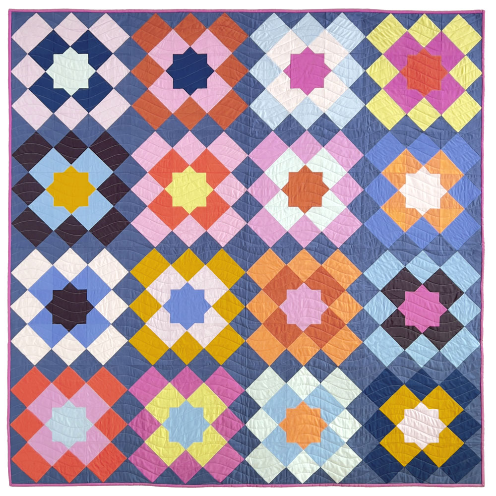 Full marrakesh quilt top, a block based quilt in multiple colors with a dark blue ground