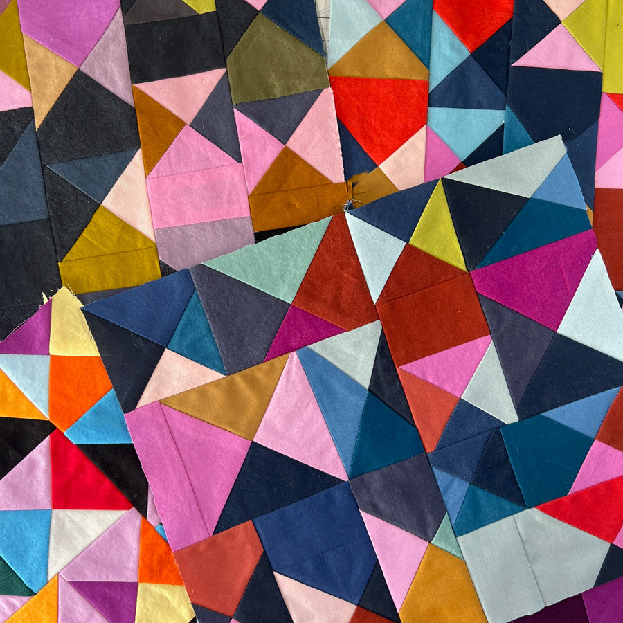 Colorful geometric quilt with triangular patterns