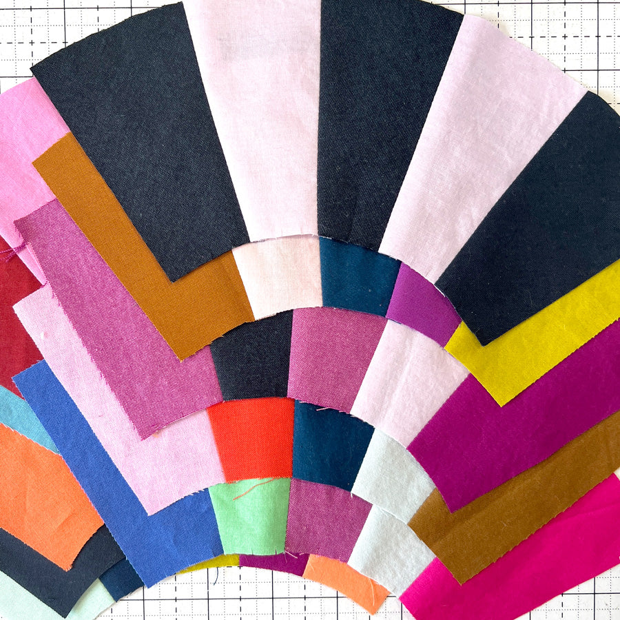 Colorful fabric swatches arranged in a circular pattern on a grid background