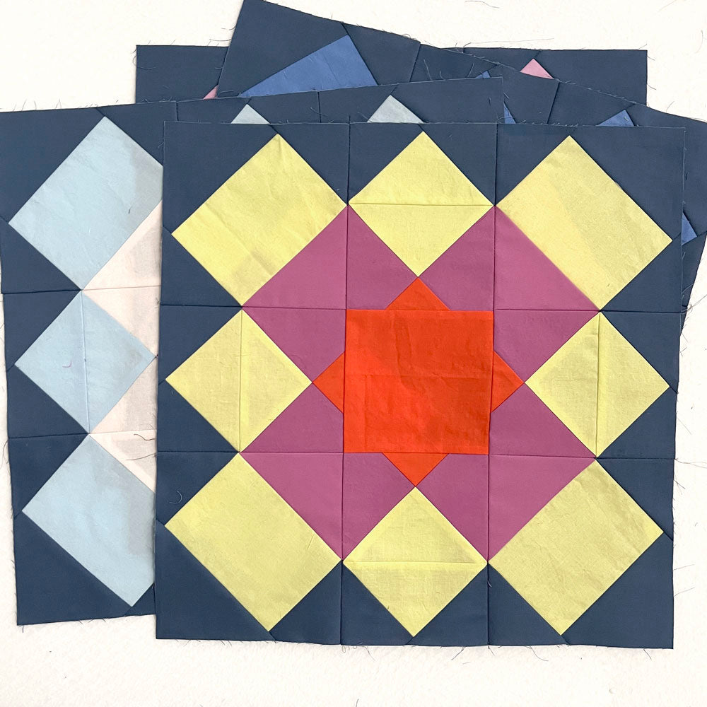 Marrakesh quilt blocks, with bright colors and a blue background