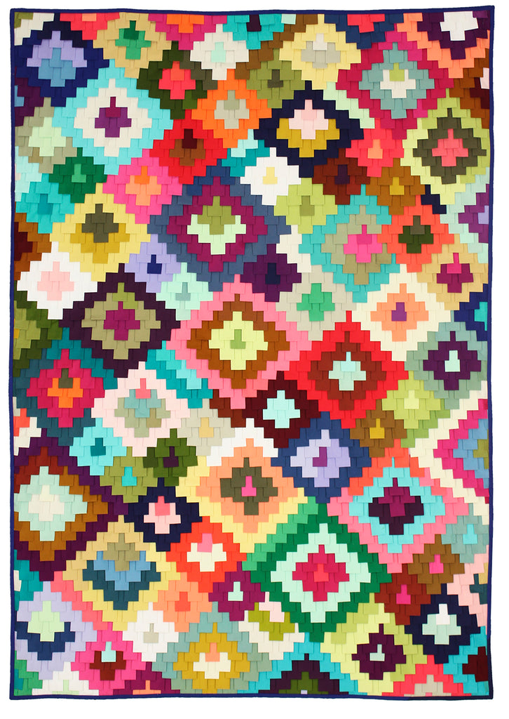 textured quilt made of colorful folded fabrics