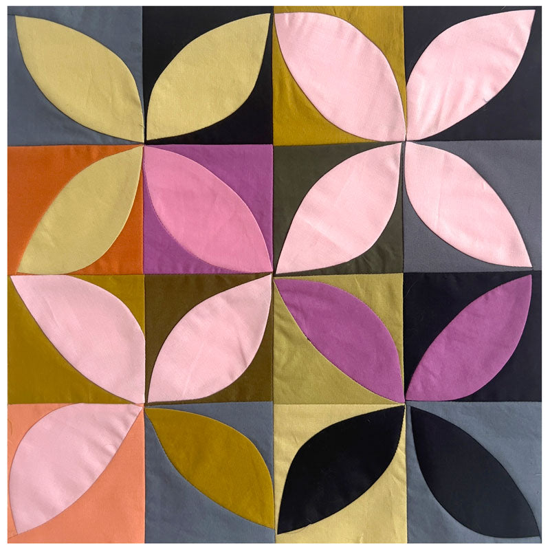A small quilt study in dusty hues made of ruler free orange peel blocks.
