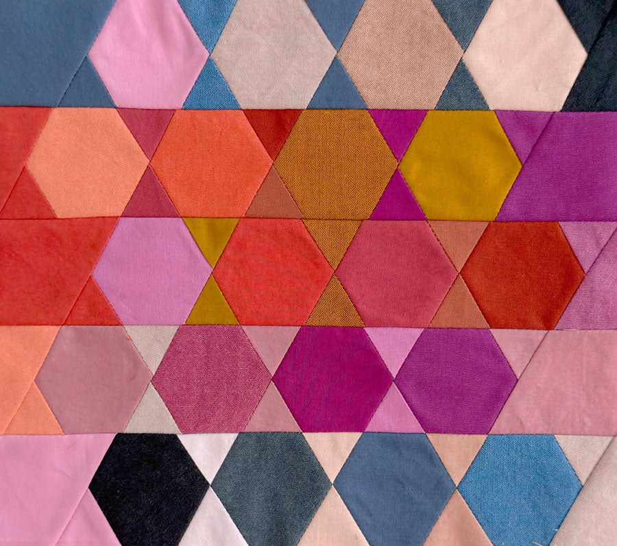 Hexagonal patchwork pattern with multicolored fabric squares