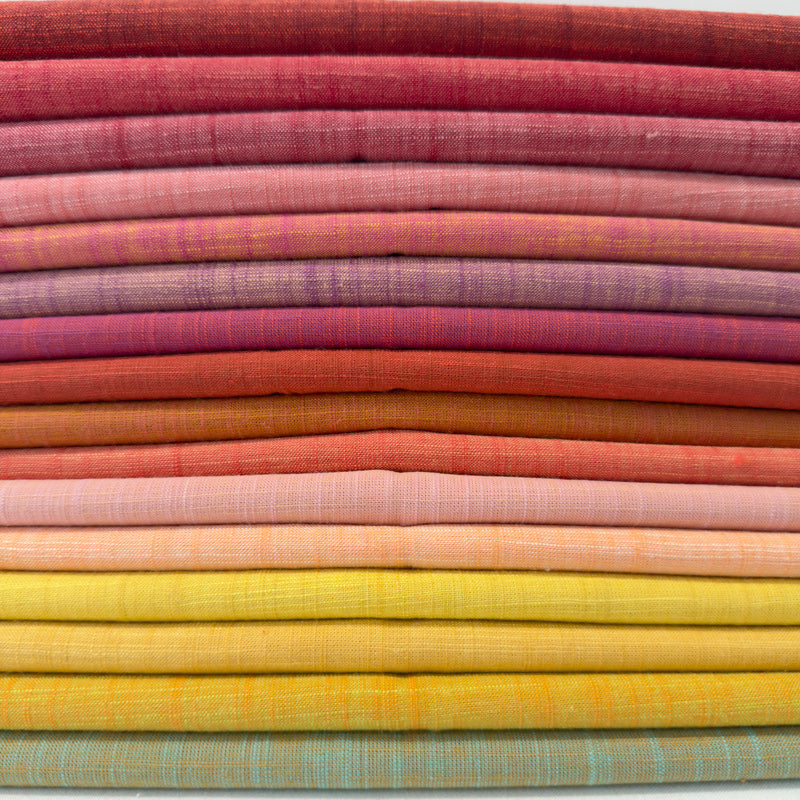 Stack of colorful fabric swatches arranged in a grid pattern.