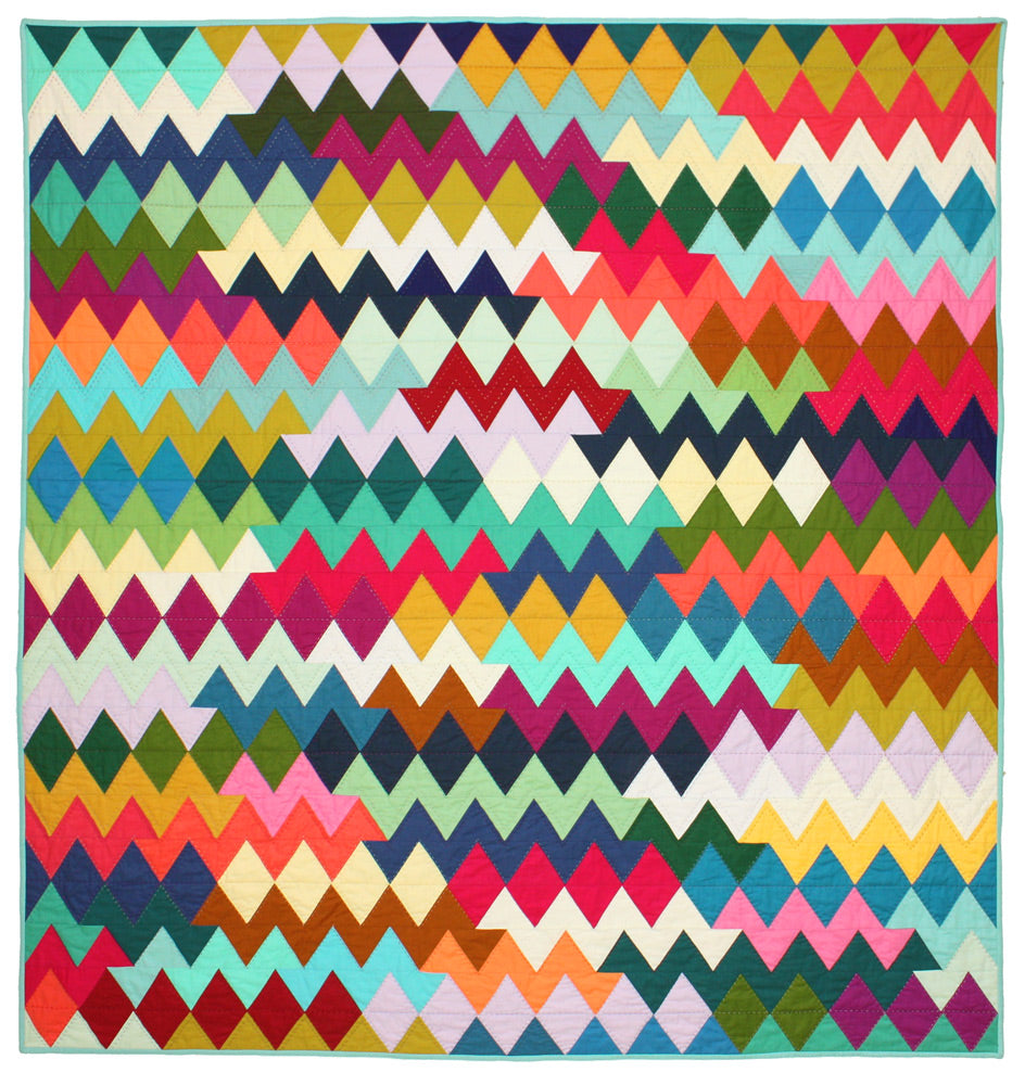 Large quilt in bright colors, made up of rows of triangles