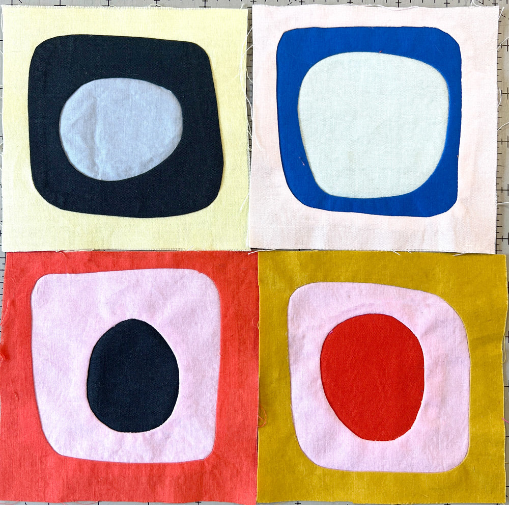 Small quilt blocks of wonky circle shapes in bright cheerful colors.