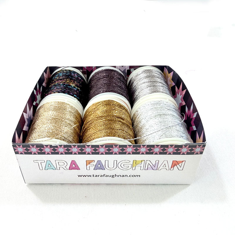 Box of Tara Faughnan thread spools on a white background