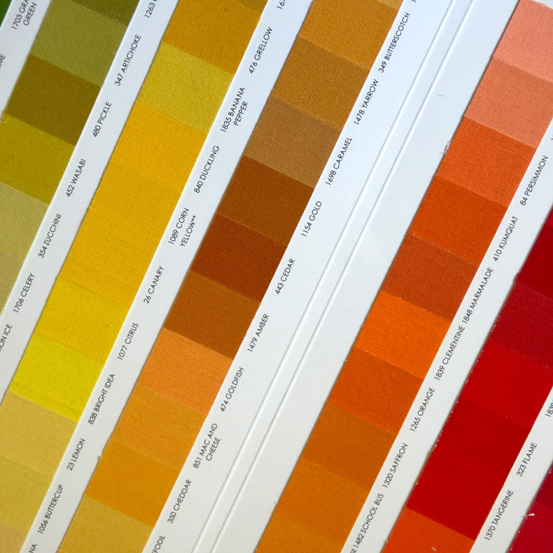 A Kona Cotton Color Card with a list of fabric colors displayed in a gradient arrangement.