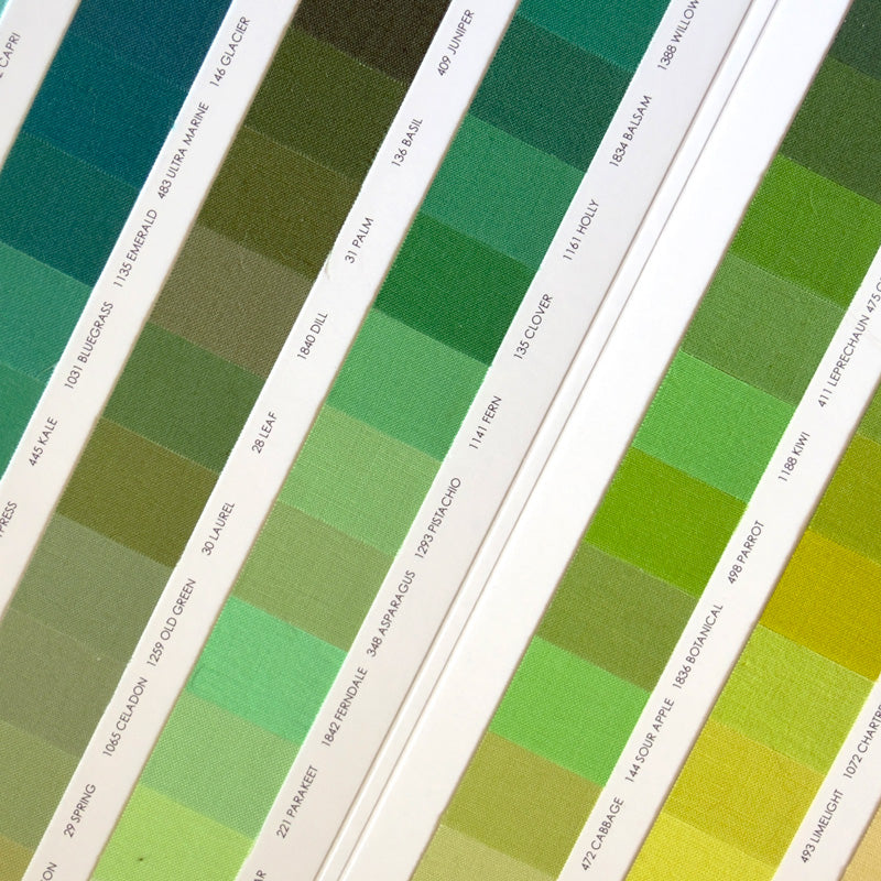 A Kona Cotton Color Card with a list of fabric colors displayed in a gradient arrangement.
