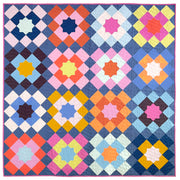 Full marrakesh quilt top, a block based quilt in multiple colors with a dark blue ground