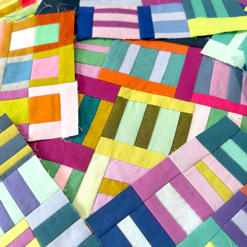 Colorful patchwork fabric squares arranged in a pattern