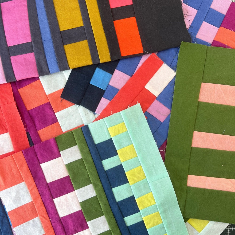 Colorful mini quilt blocks piled on top of each other