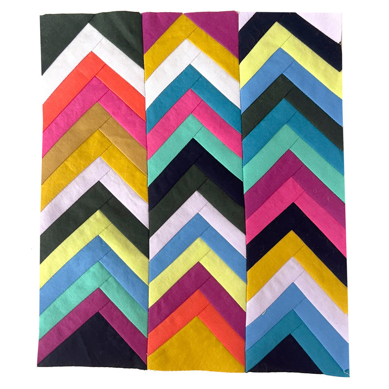 A small colorful quilt study in a chevron pattern.