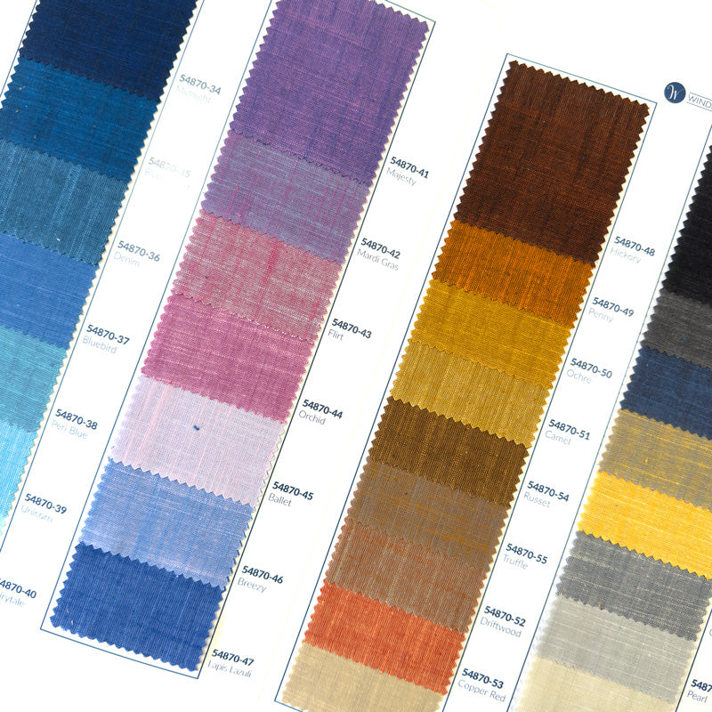 the inside of a Handloom fabrics swatch card showing small fabric swatches in various colors.