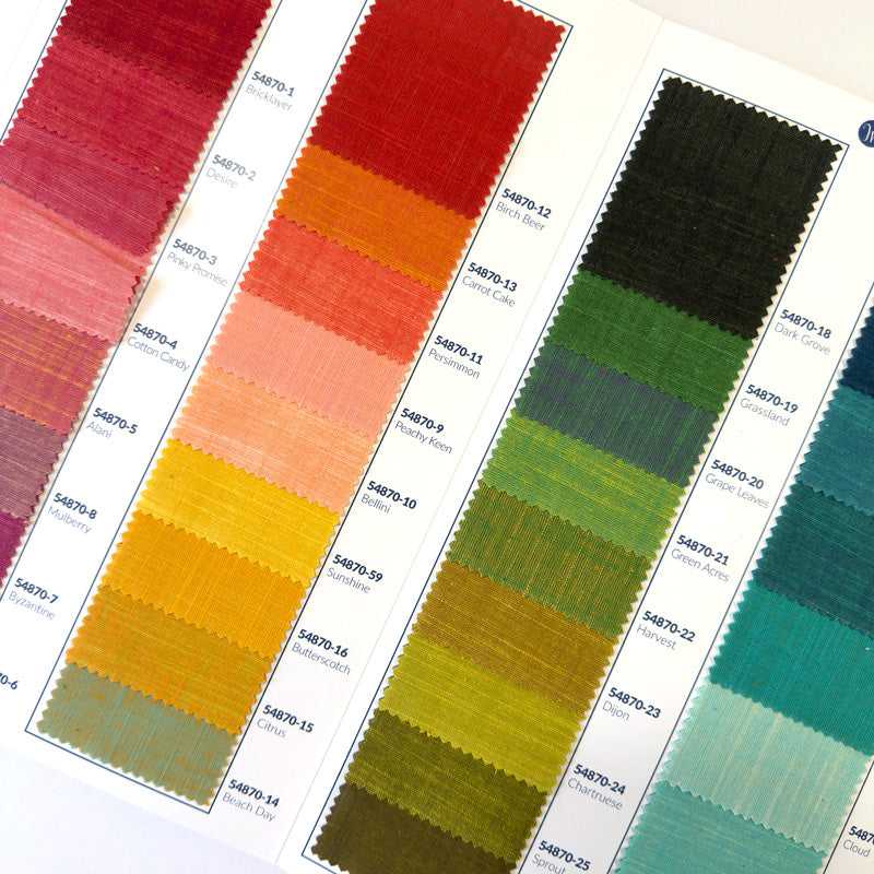 the inside of a Handloom fabrics swatch card showing small fabric swatches in various colors.
