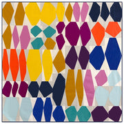 quilt made up of rock like shapes on a pale background