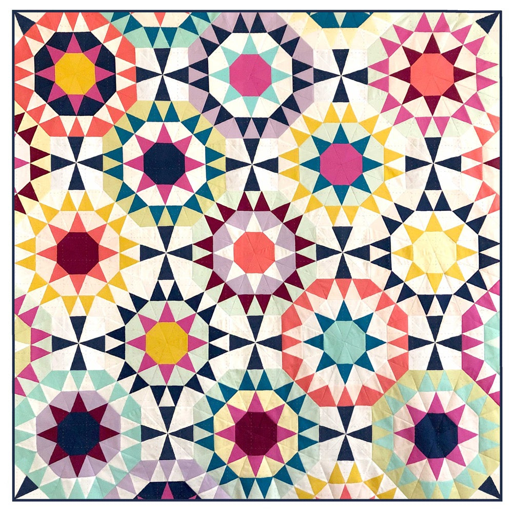 A quilt made of triangles in a kaleidoscope pattern