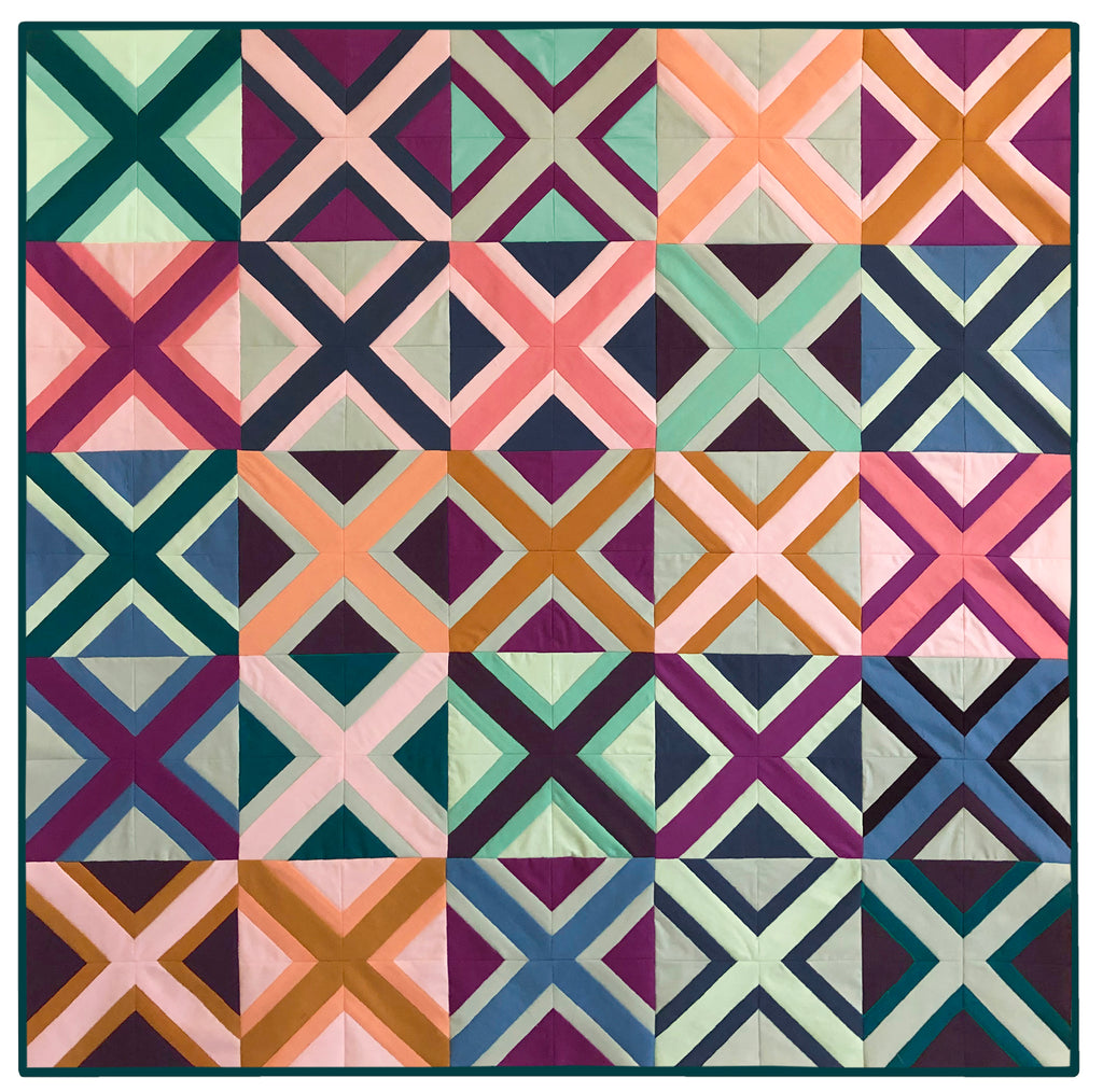 A quilt with a pattern of squares and triangles.